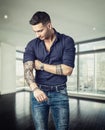 Photo of a man showing off his arm tattoo Royalty Free Stock Photo