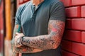 A man with tattoos on his arms. Generative AI Royalty Free Stock Photo