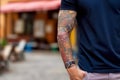 A man with tattoos on his arms. Generative AI Royalty Free Stock Photo