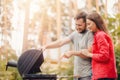 Man Teaches Girl Couple Cooking BBQ Meat