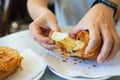 A person is tearing a croissant for breakfast or brunch Royalty Free Stock Photo