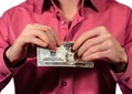 man tearing 20 US dollars banknotes isolated on a white