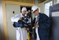 Man technician measuring levels of radiation on journalist s equipment after visiting Chornobyl Nuclear Power Plant