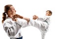 Man and teen boy fighting at aikido training in martial arts school