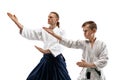 Man and teen boy fighting at aikido training in martial arts school