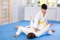 Man and teenage boy train judo fighting techniques Royalty Free Stock Photo