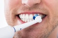 Man Teeth With Electric Toothbrush Royalty Free Stock Photo