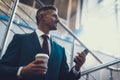 Man with telephone and coffee in hands Royalty Free Stock Photo