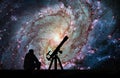 Man with telescope looking at the stars. Messier 83, Southern Pi