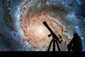 Man with telescope looking at the stars. Pinwheel Galaxy Royalty Free Stock Photo