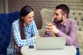 Man telling something to smiley beautiful woman Royalty Free Stock Photo