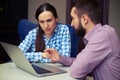 Man telling something to smiley woman Royalty Free Stock Photo