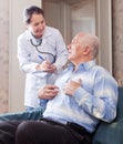 Man tells the mature doctor the symptoms Royalty Free Stock Photo