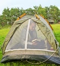 Man in the tent. Royalty Free Stock Photo