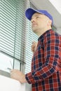 Man testing blinds on windows Royalty Free Stock Photo