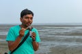 Man testing flavor ice cream. Chuski Or Baraf ka Gola also known as Ice candy, popular roadside refreshment in Indian summering