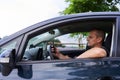 Man inside car texting on phone Royalty Free Stock Photo