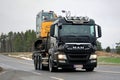 MAN TGS 35.540 Truck Hauls Excavator