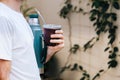 A man with a thermos and gourd mate. Yerba Mate, South American hot drink.