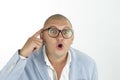 Man thinking while doing a silly face with nerd glasses Royalty Free Stock Photo