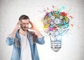 Man thinking hard, lightbulb and cog brain Royalty Free Stock Photo