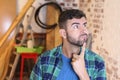 Man thinking how to do house renovations Royalty Free Stock Photo