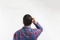 man thinking and looking to a wall, Forgetful absent minded man is trying to remember something, back view Royalty Free Stock Photo