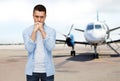 Man thinking over airplane on runway background Royalty Free Stock Photo