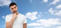 Man thinking over blue sky and clouds background Royalty Free Stock Photo