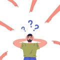 Confused young guy with question marks Royalty Free Stock Photo