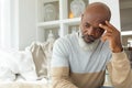 Man thinking while sitting inside a room Royalty Free Stock Photo