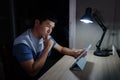 man thinking while using tablet at night Royalty Free Stock Photo