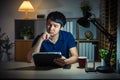 man thinking while using tablet at night Royalty Free Stock Photo