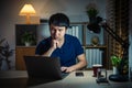 man thinking and working with laptop at night Royalty Free Stock Photo