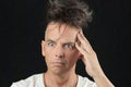 Man Thinks, Looking Off Camera, Hair Piled On Head Royalty Free Stock Photo
