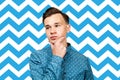 The man thinks. Portrait of a doubting young white guy Royalty Free Stock Photo