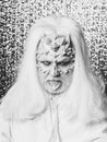 Man with thorns on face in white wig Royalty Free Stock Photo