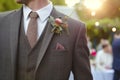 man in a threepiece suit with a boutonniere at an upscale event Royalty Free Stock Photo