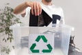 Man throwing away broken mobile phones in recycle container
