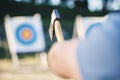 Man throwing axe at sports range, archery training or practice with board circle for goal, game and exercise. Strong Royalty Free Stock Photo