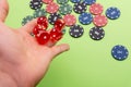 man throwing dice. Poker chips. Green background Royalty Free Stock Photo