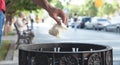 Man throwing garbage in a trash bin Royalty Free Stock Photo