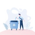 Man throwing plastic bottle garbage in the big trash can. Recycling and ecological concept Royalty Free Stock Photo