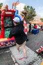 Man Throws Football Toward Targets At College Football Fan Fest