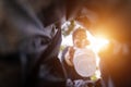 Man throws garbage into a garbage can on the street. With a worm view from the inside of the trash bin. Selective focus Royalty Free Stock Photo