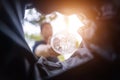 Man throws garbage into a garbage can on the street. With a worm view from the inside of the trash bin. Selective focus Royalty Free Stock Photo