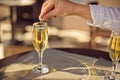 man throws wedding ring in glass of champagne Royalty Free Stock Photo