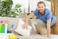 man tidying up sofa Royalty Free Stock Photo
