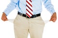 Man with tie, khakis, dress shirt, and belt, pulling out empty pocket Royalty Free Stock Photo