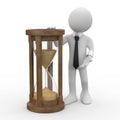 Man with tie and suit, leaning on an hourglass Royalty Free Stock Photo